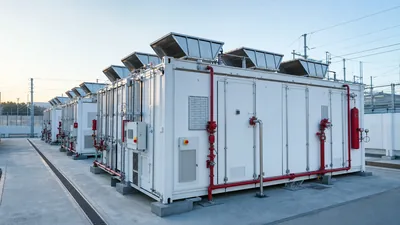 Industrial utility-scale energy storage container highlighting fire battery deflagration panels and suppression hardware