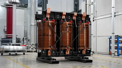 Dry-type single to 3 phase transformer assembly inside an electrical manufacturing and testing facility
