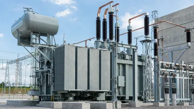 High-voltage step up transformer installed in a utility transmission substation yard