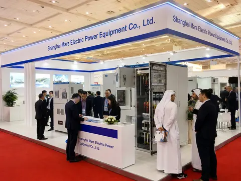 MARS sales team greeting international buyers at an electrical equipment exhibition